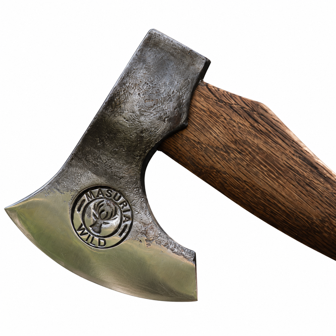 Close-up of the Masuria Wild axe head and visible wooden handle on a white background