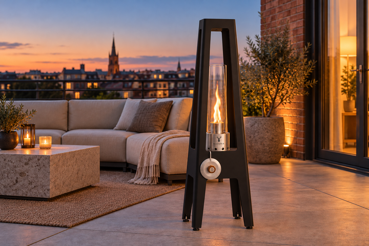 TORRE Black bioethanol lamp on a rooftop terrace.